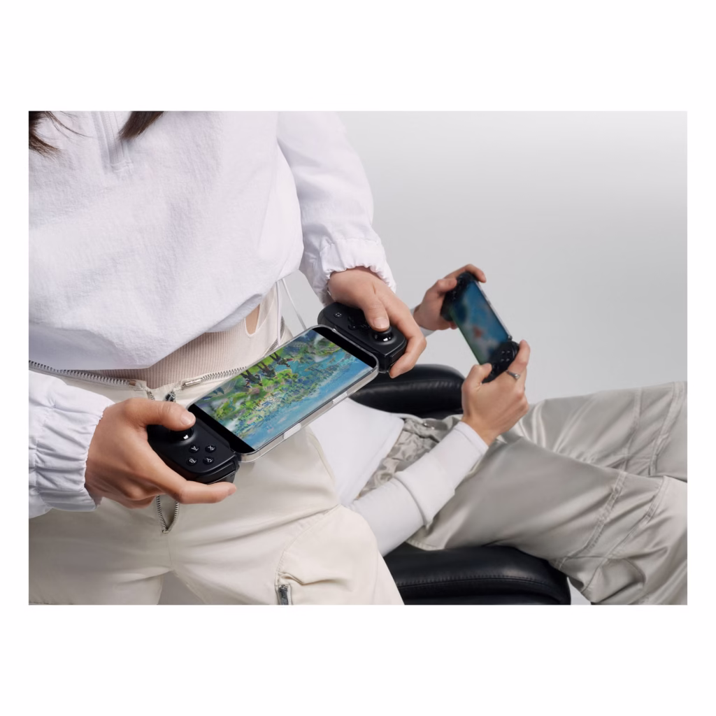 Two players using Backbone Pro controllers for wireless mobile gaming via Bluetooth Low Energy