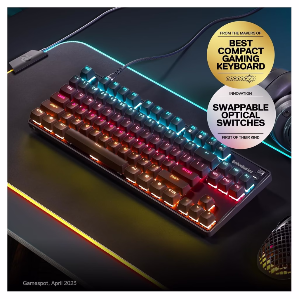 SteelSeries Apex 9 TKL on RGB gaming desk with GameSpot Best Compact Gaming Keyboard award badge