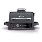 Ninja Woodfire Outdoor Grill OG701C angled view, 7-in-1 master grill and BBQ smoker