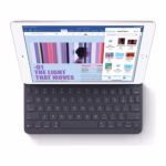 Apple iPad 7th Gen Silver docked to a Smart Keyboard through the Smart Connector