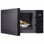 LG MSER1590B black countertop microwave side profile with door open and food on the turntable