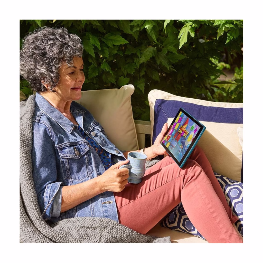 Fire HD 10 tablet being used while relaxing outdoors