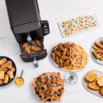 Ninja DoubleStack 2-Basket Air Fryer SL201C surrounded by an entertaining spread of air-fried appetizers