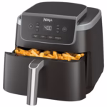 Ninja AF141C air fryer with the drawer slid open and a full basket of French fries