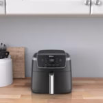 Ninja AF141C air fryer in black standing on a kitchen countertop