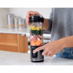 Pressing the separate power and blend buttons on the Ninja Blast BC151BKC blender