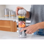 Pressing the separate power and blend buttons on the Ninja Blast BC151WHC blender