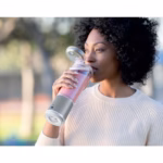 Drinking a smoothie straight from the easy-open sip lid of the Ninja Blast BC151WHC