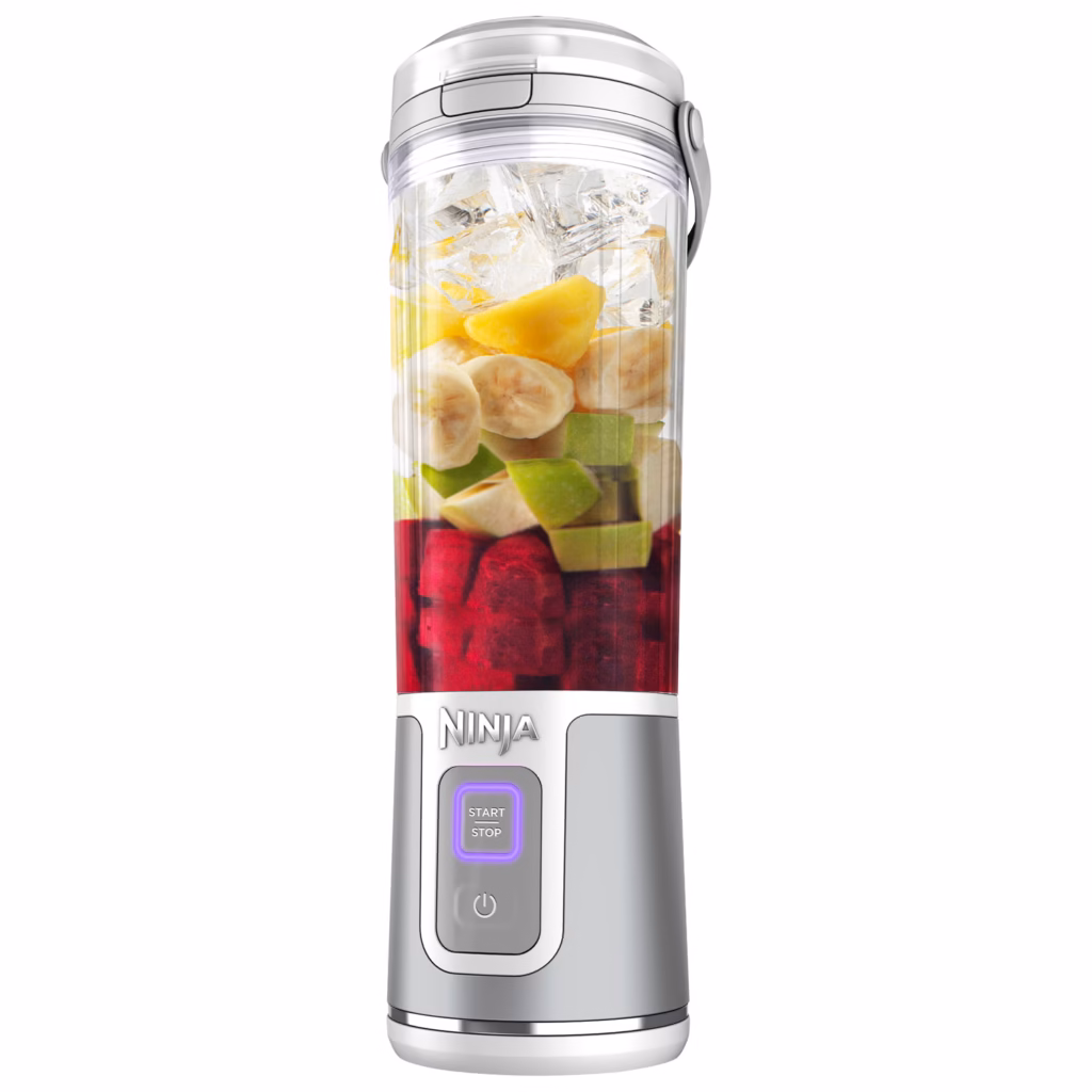 Ninja Blast BC151WHC blender vessel filled with layered berries, banana and greens