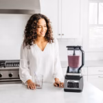 Ninja BN801BBYC 72 oz Total Crushing pitcher blending a berry smoothie