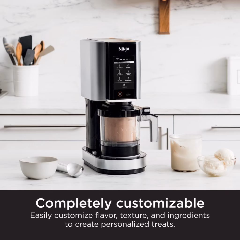 Ninja CREAMi NC301C on a kitchen counter beside customized ice cream and sorbet servings