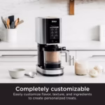 Ninja CREAMi NC301C on a kitchen counter beside customized ice cream and sorbet servings
