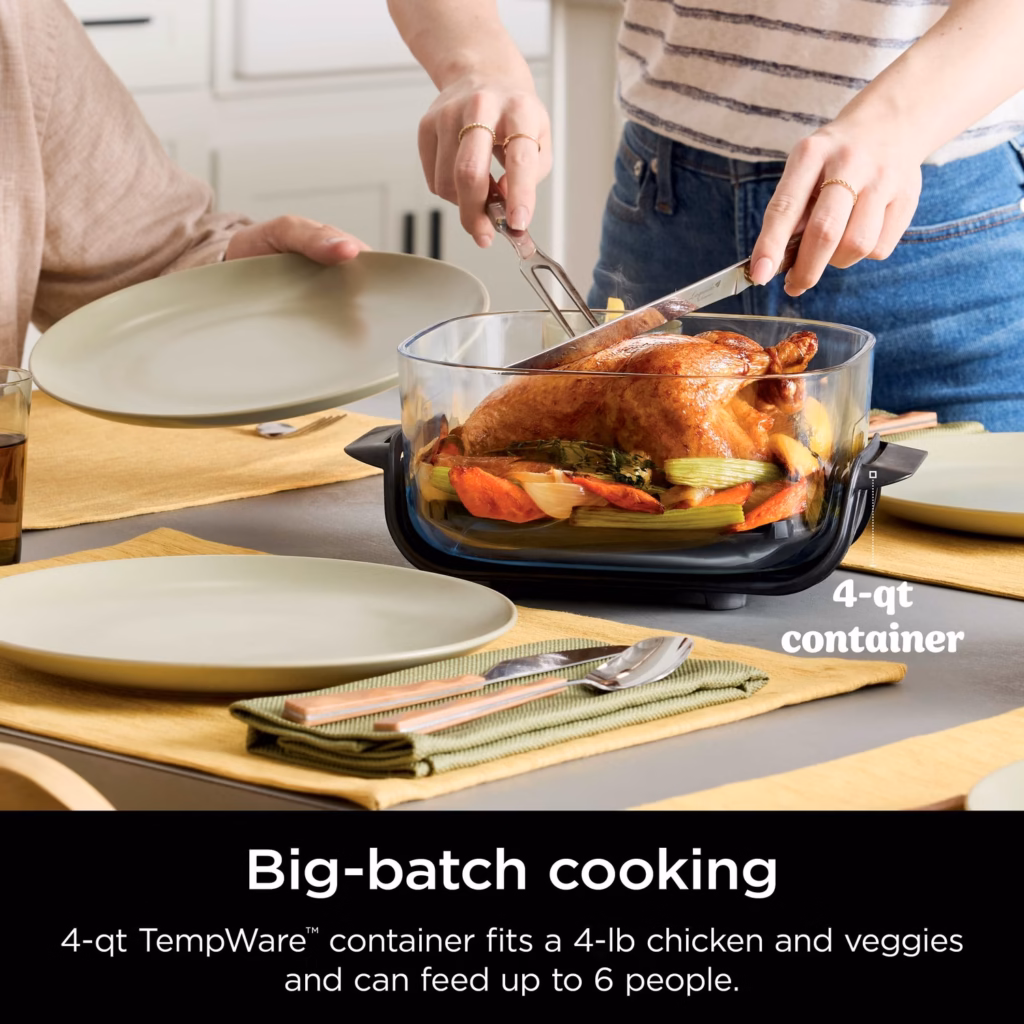 Ninja Crispi 4-qt TempWare container holding a roast chicken and vegetables
