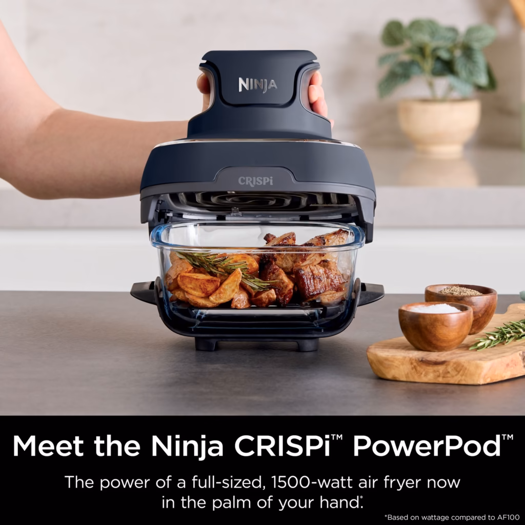 Ninja Crispi PowerPod, the 1500-watt air fryer head, held in one hand
