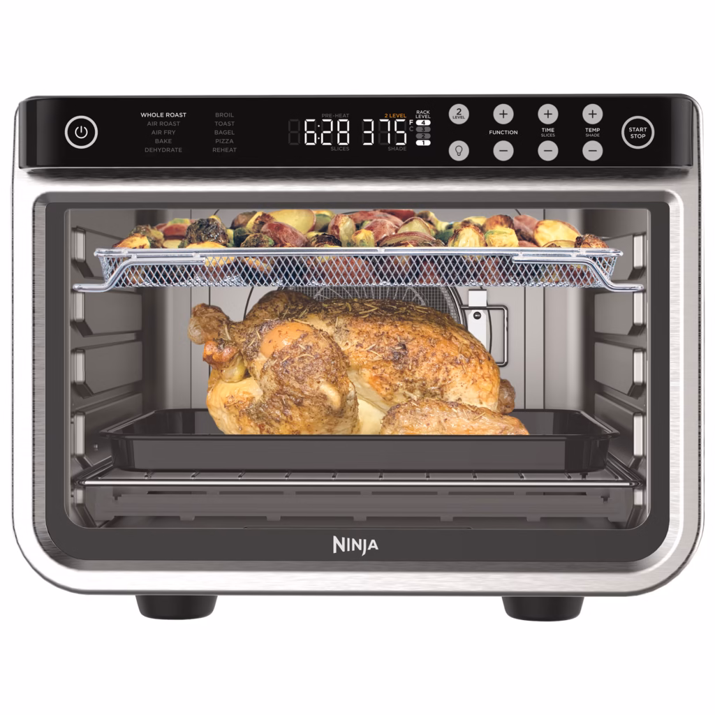 Ninja DT201C cooking a whole chicken on the lower rack and vegetables on the upper rack at the same time