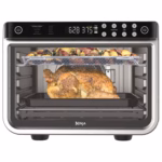 Ninja DT201C cooking a whole chicken on the lower rack and vegetables on the upper rack at the same time