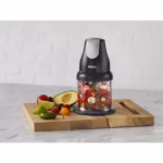Ninja NJ100C Express Chop bowl filled with freshly chopped salsa on a wooden cutting board