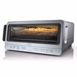 Ninja Flip Toaster Oven SP151C in stainless steel, front three quarter view with fries in the air fry basket
