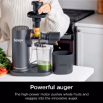 Ninja NeverClog Cold Press Juicer JC151C auger and feed chute in use