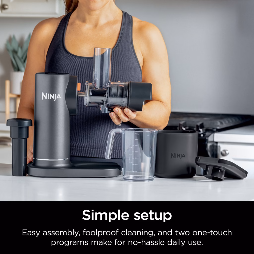Ninja NeverClog Cold Press Juicer JC151C parts laid out for simple assembly