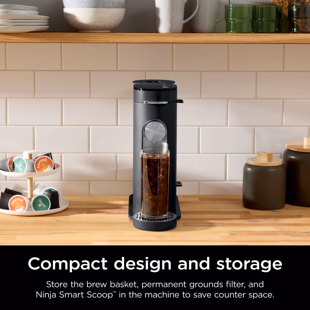 Ninja PB040C coffee maker on a kitchen counter beside a pod carousel, showing its compact footprint