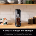 Ninja PB040C coffee maker on a kitchen counter beside a pod carousel, showing its compact footprint