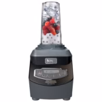 Ninja BL661BBYC 16 oz Nutri Ninja cup filled with berries and ice on the blender motor base