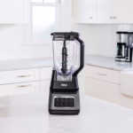Ninja BN701C Professional Plus blender standing on a white marble kitchen counter