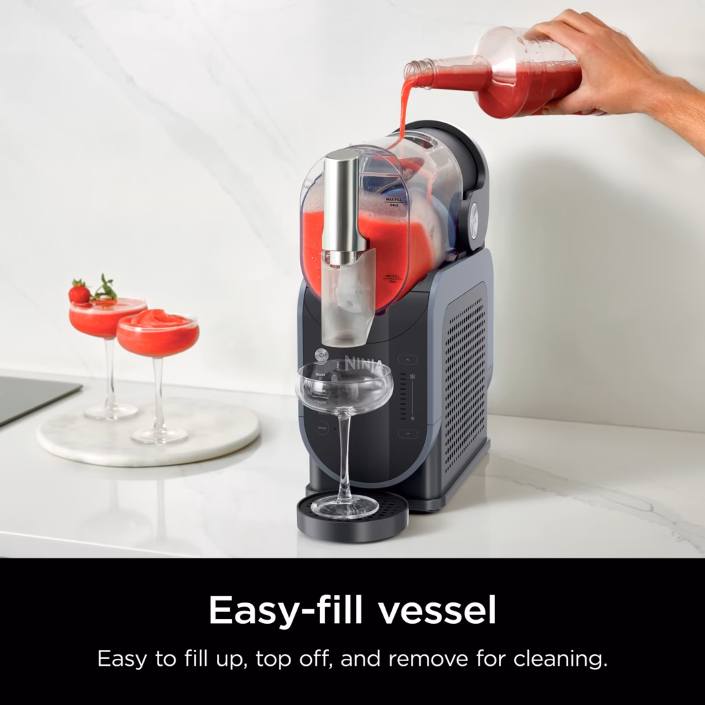 Ninja SLUSHi easy-fill 88 oz vessel being topped up from a bottle