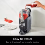 Ninja SLUSHi easy-fill 88 oz vessel being topped up from a bottle