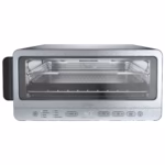 Ninja SP151C toaster oven front view with the air fry basket and wire rack in the empty cavity