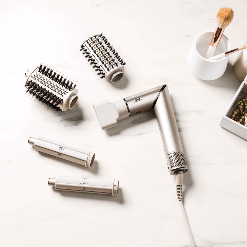 Shark FlexStyle hair dryer and styling attachments laid out on a marble counter