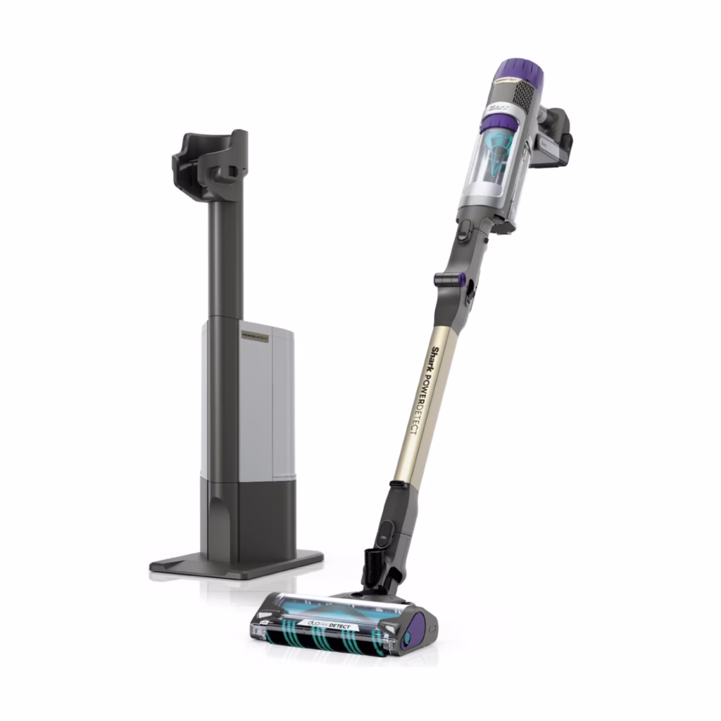 Shark PowerDetect IP3251C cordless stick vacuum leaning beside its Auto-Empty dock, three quarter view