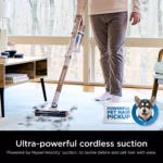 Shark PowerPro Flex IZ380HC cordless stick vacuum lifting pet hair from an area rug beside a sunlit window